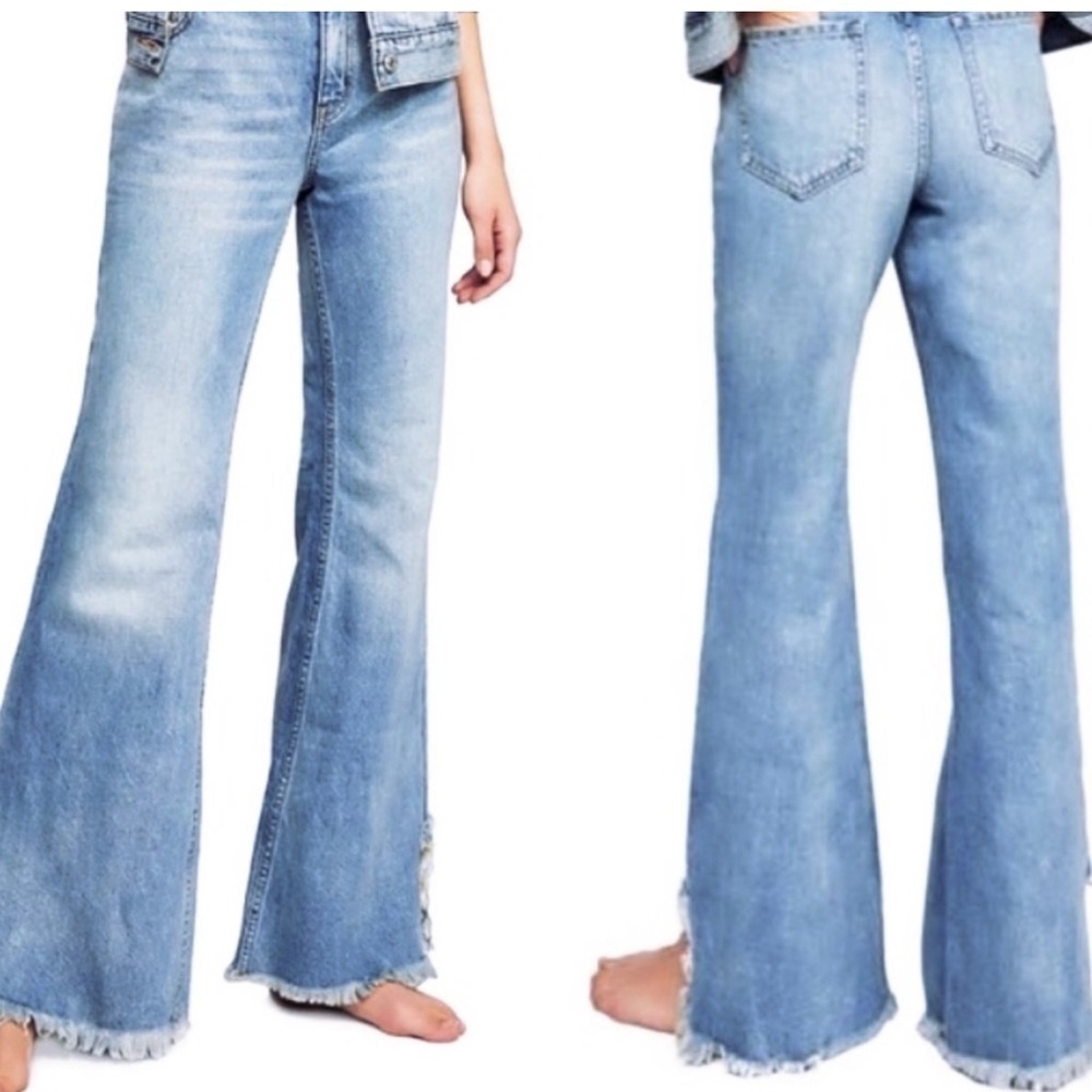 We the Free  flare jeans with a frayed hem in a light blue wash.